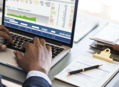 Black businessman using computer laptop